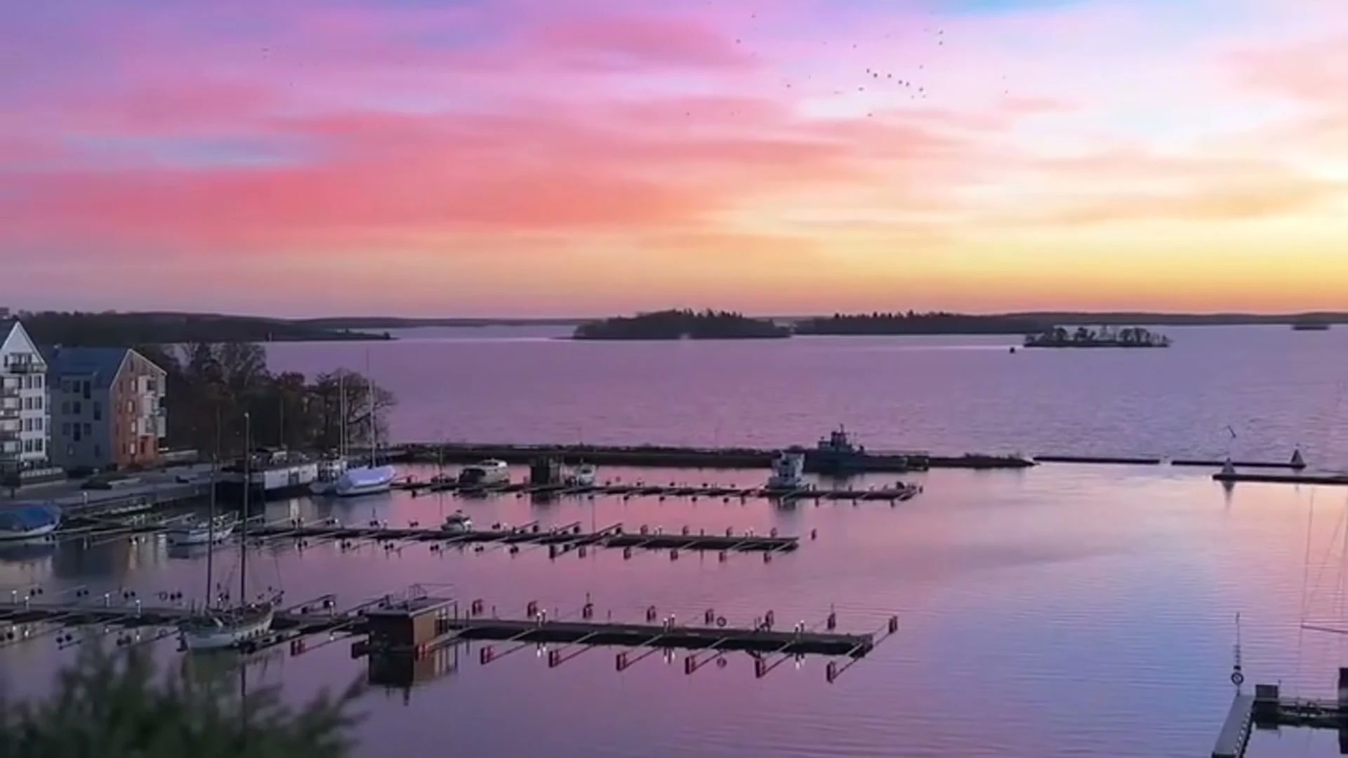 Sunset over the water at an ESS Group waterfront hotel
